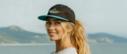 Woman on a boat with mountains in the background